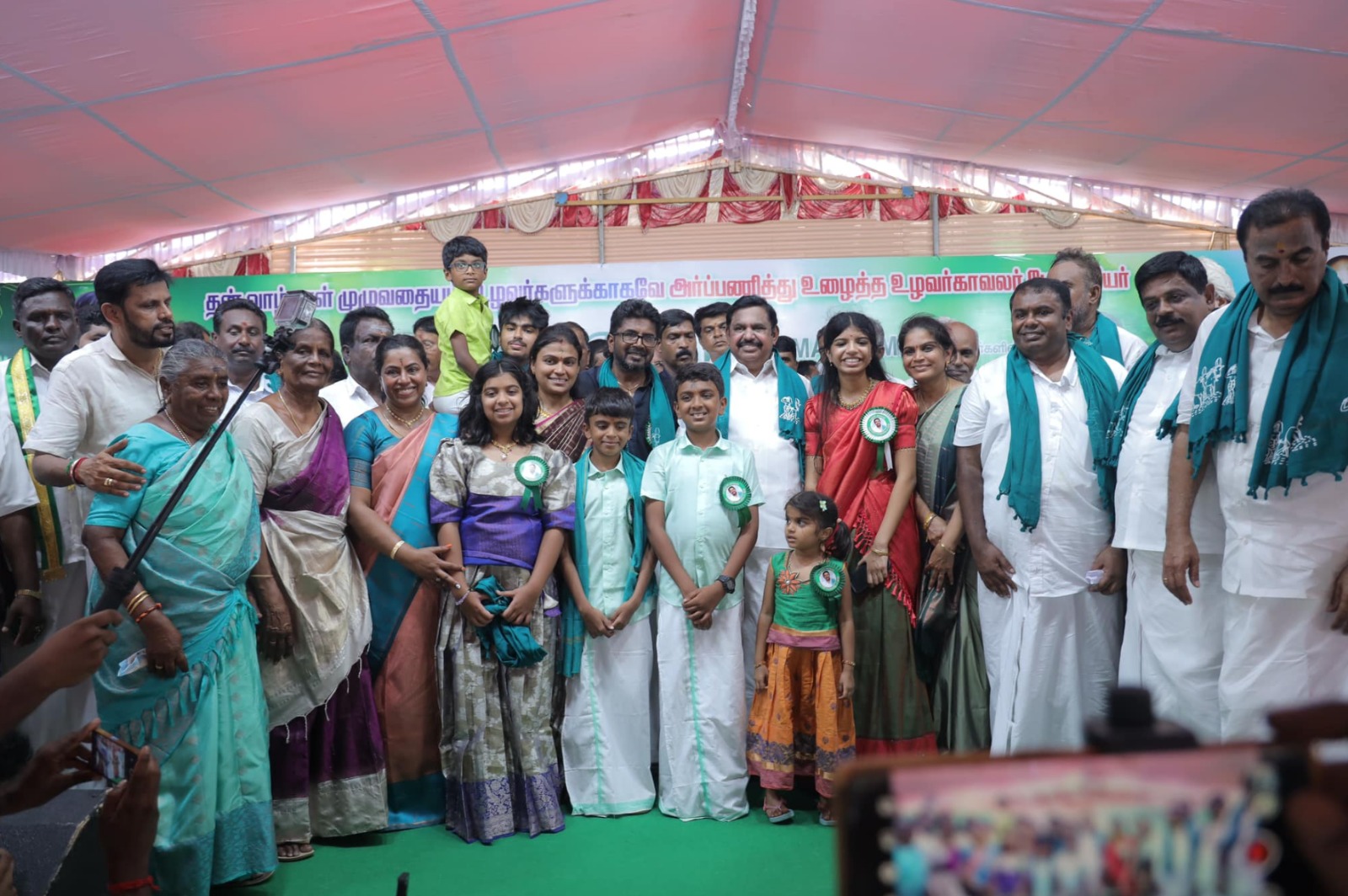 Coppell High School junior Iniya Nandakumar [wearing red half saree] attends a gathering meant to honor her grandfather, N.S. Palanisamy, in Tamil Nadu. Nandakumar continues her grandfather N.S. Palanisamy’s legacy of advocating for farmers facing unfair treatment in South India. Photo courtesy Iniya Nandakumar.