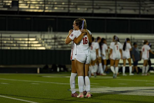 Coppell junior forwards Emiline Holder and Logan Kutchins embrace after the match against Keller on Tuesday at Keller ISD Athletics Complex. The Indians defeated the Cowgirls, 2-1, in the Class 6A Region I final. Photo by Naseeha Masood