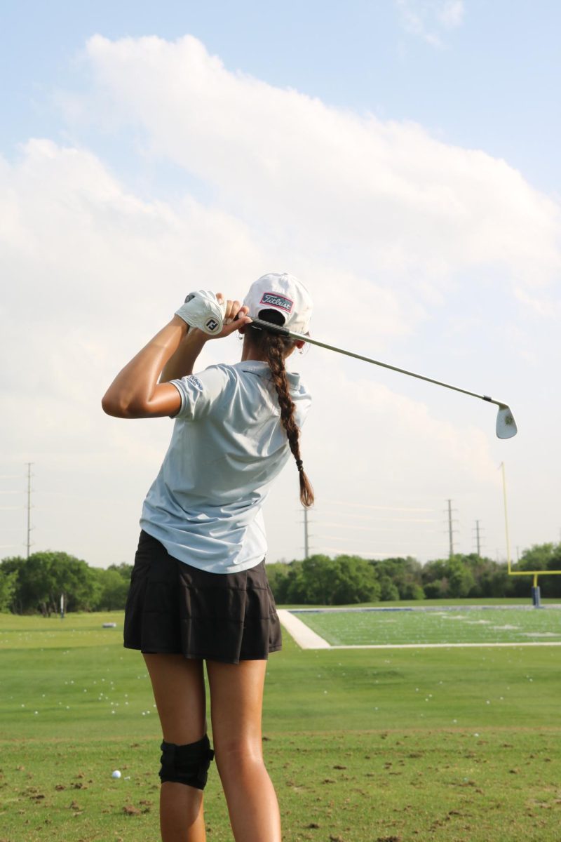 Coppell senior golfer Riya Bapna practices at Cowboy Golf Club on April 27. Bapna signed to Boston College to play golf.