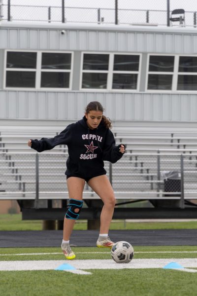 Coppell freshman JV2 midfielder Taleen Abuhamdeh passes to midfielder Harper Fiveash during practice at Lesley Field on April 22. Abuhamdeh has been playing soccer since she was 3 and her energy has contributed to team spirit.