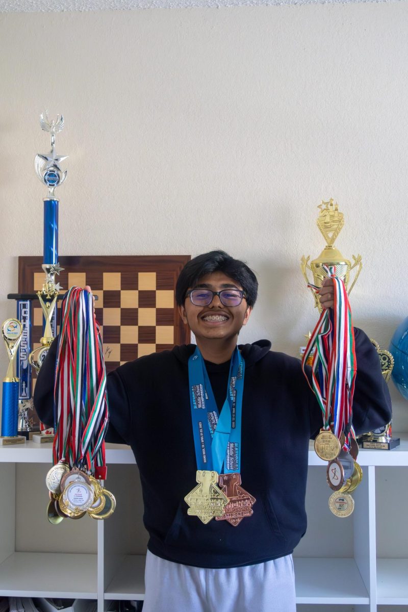 Coppell High School sophomore Aarav Thilop holds the medals earned from years of his love for chess. Thilop has been competitively playing chess since he was 6 and holds a national 2000 ELO rating.