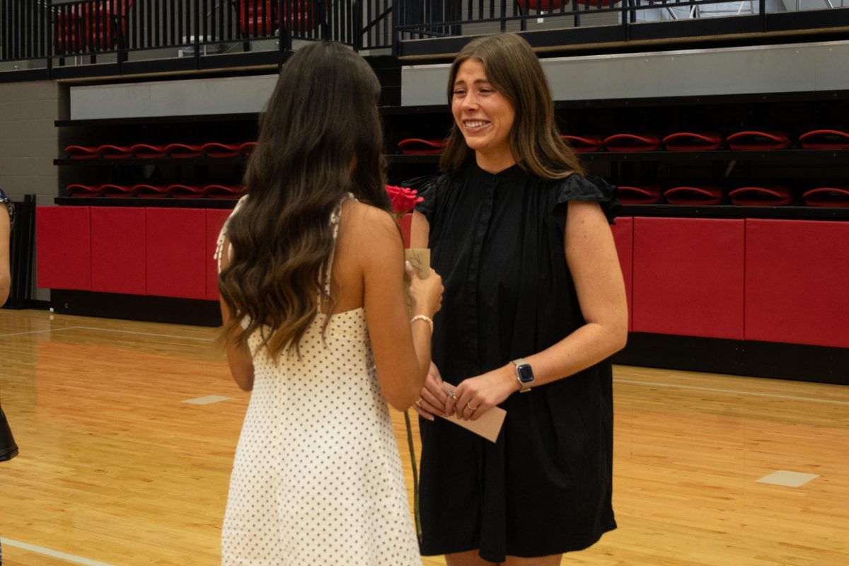 Coppell High School senior Sophia Tran selected English II teacher Hannah Corley to pin her senior pin on Wednesday at CHS Arena. The Senior Pinning Ceremony honors members who are important in seniors' life throughout high school. 