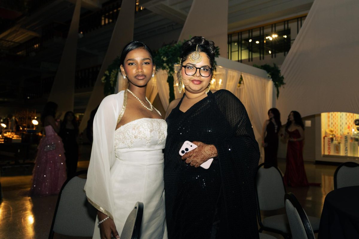Seniors Atheeqa Shaik and Anshika Arora attend Coppell High School’s prom on Saturday at Dallas Market Center. CHS prom featured its theme of “Believe in the Magic, Dance in the Moment!" Photo by Naseeha Masood
